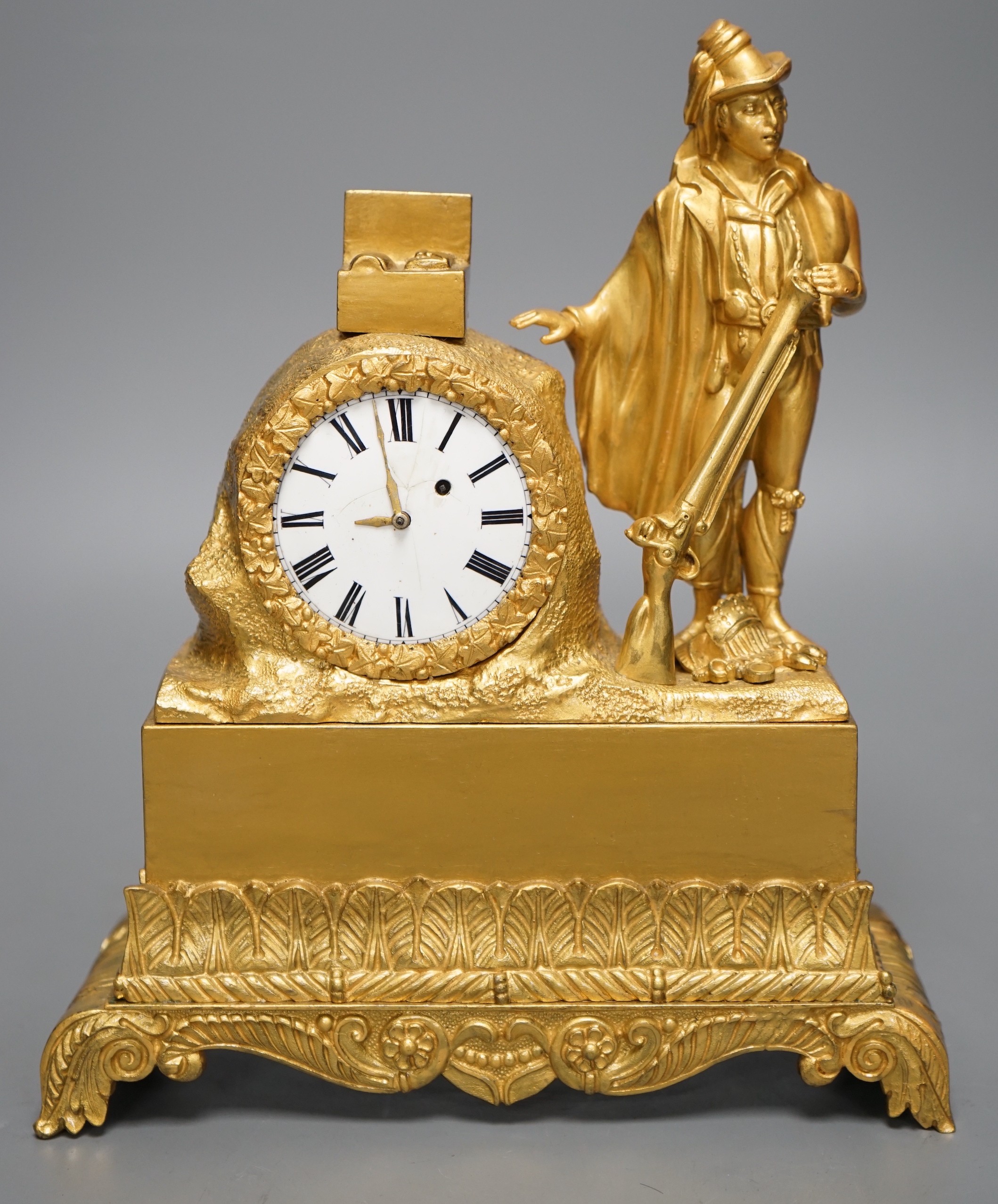 A 19th century ormolu clock with 'Huntsman' figure, 25cm tall